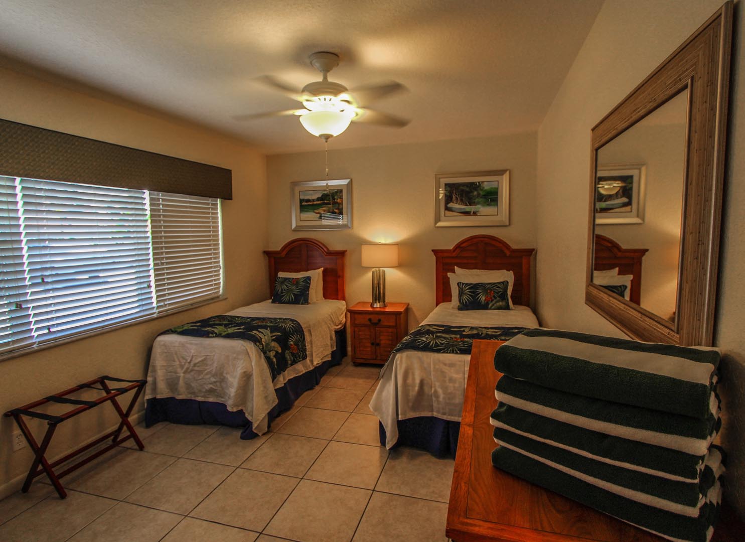 A bedroom with double beds at VRI's Mariner Beach Club in St. Pete Beach, Florida.